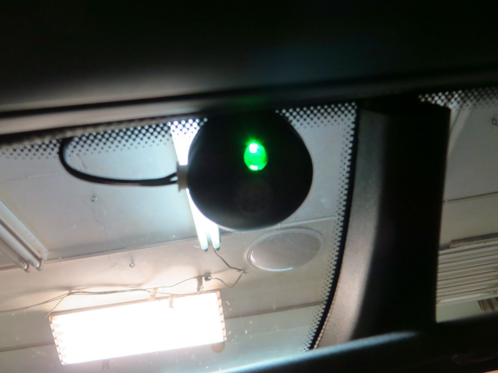 flashing green light up by rear view mirror? what is it?