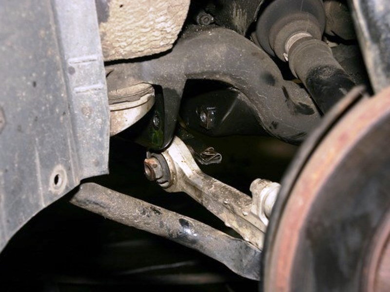Remove the inner pivot bolt from the lower control arm