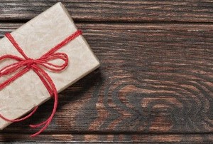 a wrapped gift card on wood