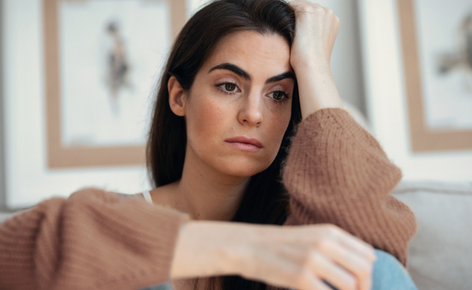 Stressed woman needs some chiropractic care.