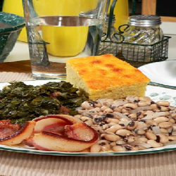 Beans, greens and cornbread on a plate