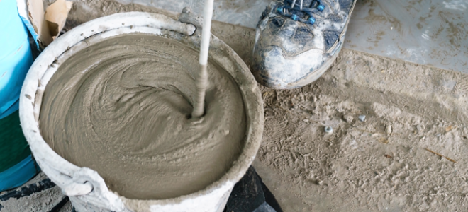 mixing concrete in a bucket