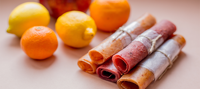 Citrus Fruit and Rolls of Fruit Leather