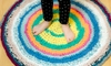 Someone standing on a round, fabric rug