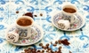 Cups and saucers on a tiled surface