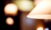 A close-up of a lamp with light in the background. 