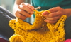 hands knitting golden fabric
