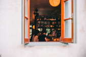 casement window looking into a bar