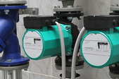 blue and green circulation pumps for a water boiler