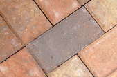 Looking closely at a normal formation of laid brick pavers.