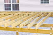 deck ledger board support frame next to house