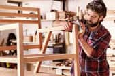 man building wood chair