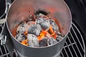 grill with coals lit in chimney starter