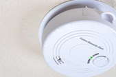 Carbon monoxide detector on home ceiling.