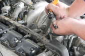 a person working on a car engine