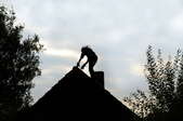A man on a roof.