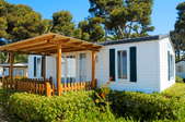 a mobile home with attached pergola
