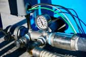 deep well pressure gauge attached to pipes