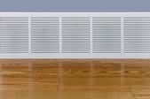 baseboard heater next to a wooden floor