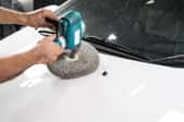 polishing car hood with tool