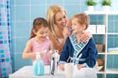 Woman with children in a bathroom