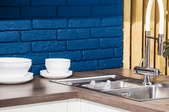 Kitchen with blue backsplash