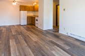 Empty room with hardwood flooring