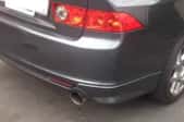 Tailpipe on a charcoal-colored car