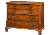 A wooden chest of drawers again a white background.