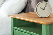 bedside nightstand with clock