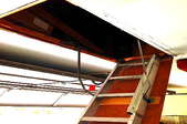 A fully-extended ladder to an above-garage attic.