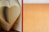 a book with pages folded into a heart shape
