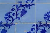 Painted ceramic tile.