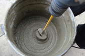 wet concrete being stirred with a mixer