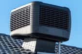 an evaporative cooler system on a roof
