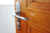 Wooden door with silver lever door handle