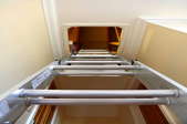 A ladder leading up to an attic space.
