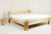 wood bed frame with white mattress