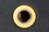 An ordinary auxiliary port with a yellow rim.