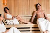 A man and a woman in a sauna.