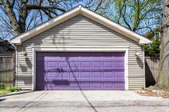 A home garage door, painted purple.