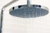 water falling from a rain-style shower head