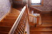 Wood stairs with railings.