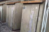A row of old sheds that need paint. 