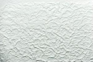 A close-up of a popcorn ceiling.