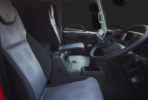 red truck interior front seats with steering wheel
