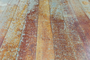 wood floor with damaged stain from wear