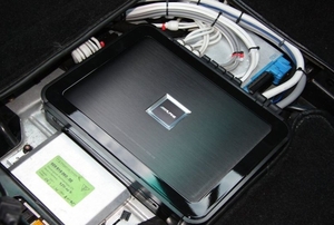 An installed car radio amplifier.