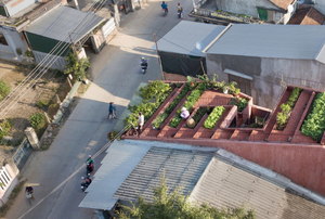 one building in a neighborhood with a terrace garden.