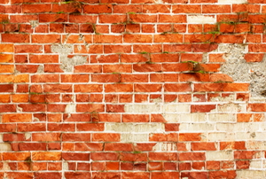 damaged faux brick panel wall